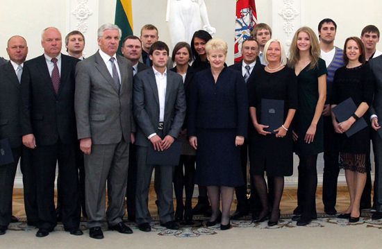 Mr Garbaliauskas, LSSA President with Mrs Grybauskaite, the President of the Lithuania, and athletes