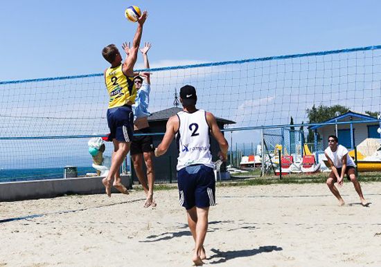 Men's beach volleyball matches near the sea