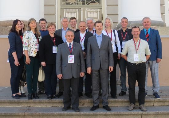 Guests in front of the University, with the Rector