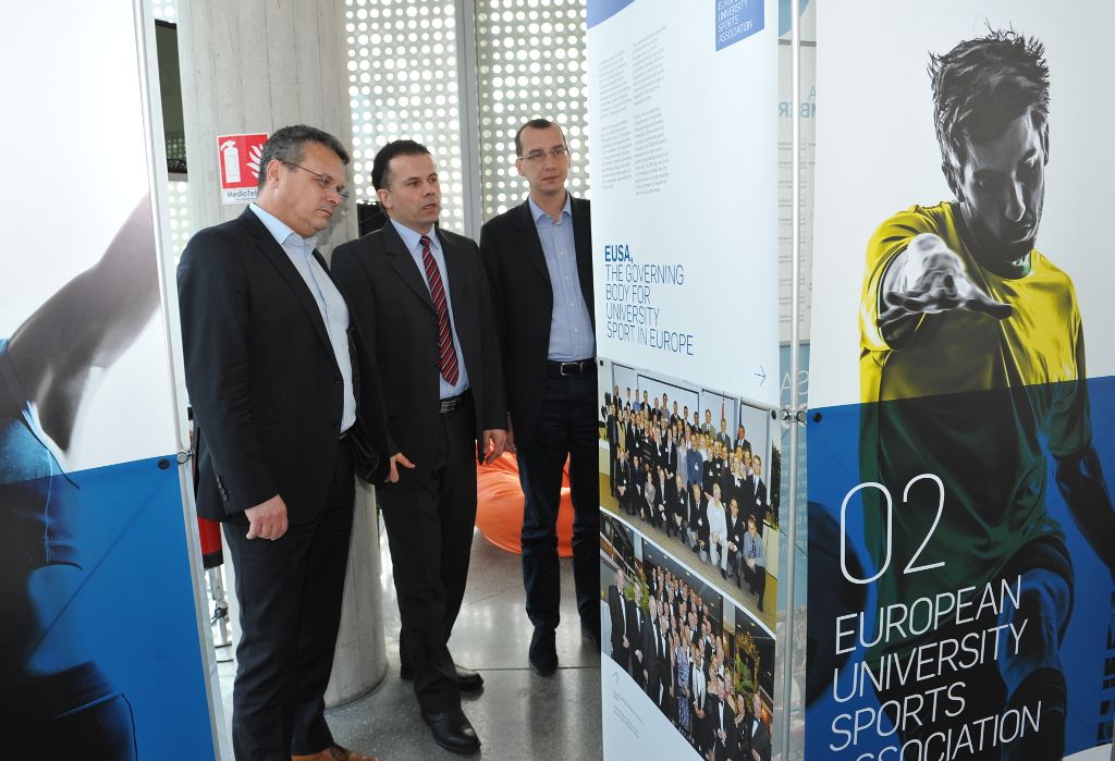 EUSA Sports Manager Mr Perosa guiding the Rector and Vice-Mayor through the Exhibition