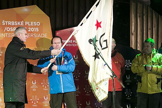 FISU Vice-President Mr Oleg Matytsin passing the FISU flag to the Organisers in Spain